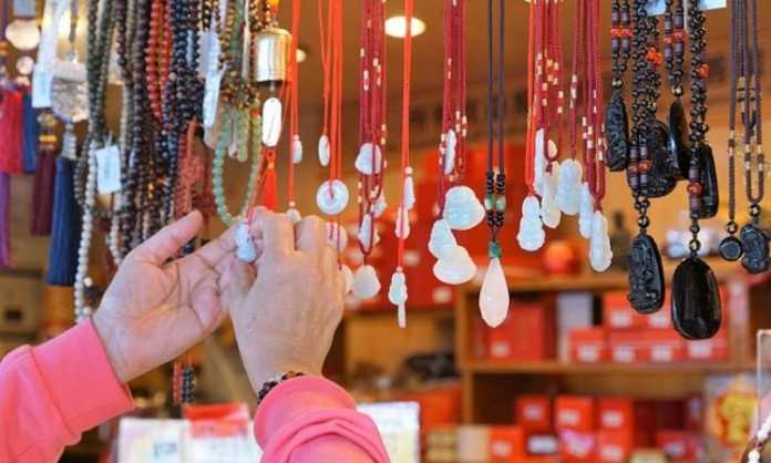 a village man checking his crafts stall