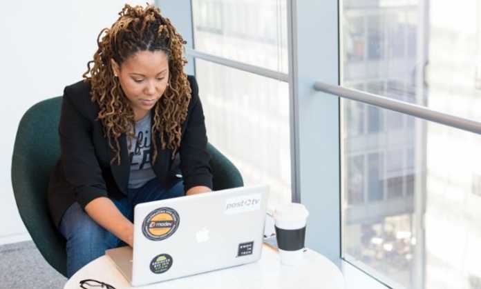 A woman utilizing relationship mapping software to enhance organizational strategies for a manufacturing company